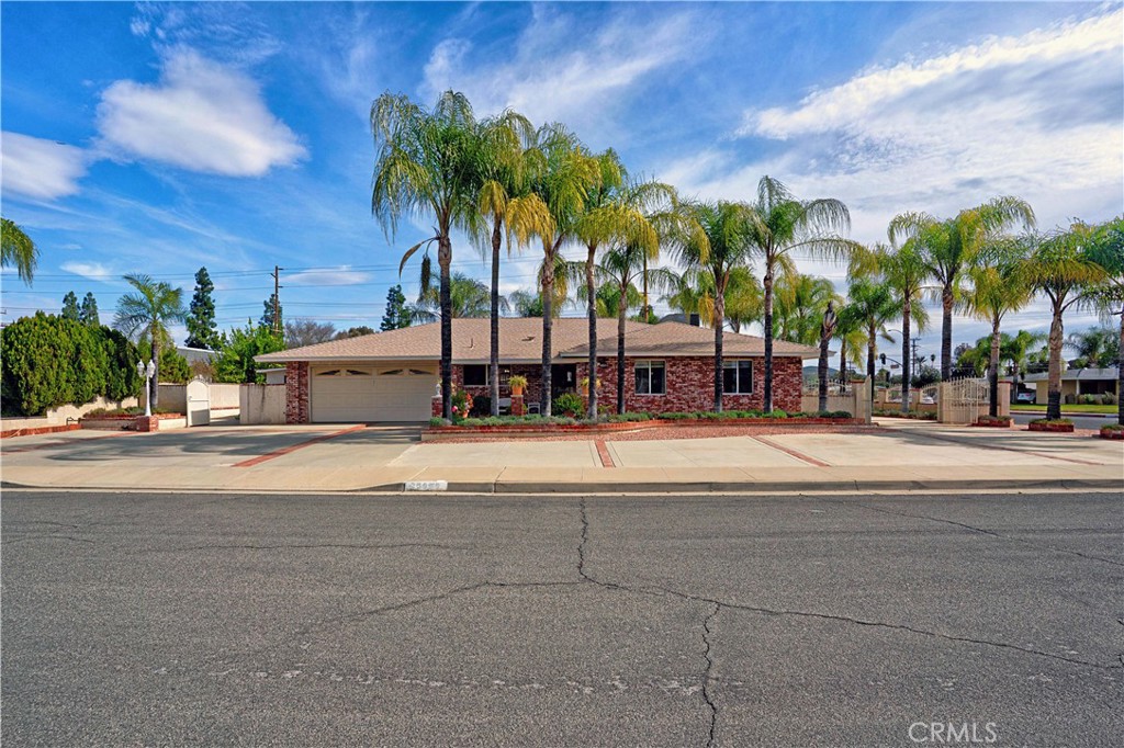 25990 Roanoke Road Menifee, CA 92586 - Photo 4 of 47 a view of palm trees and a house in the background