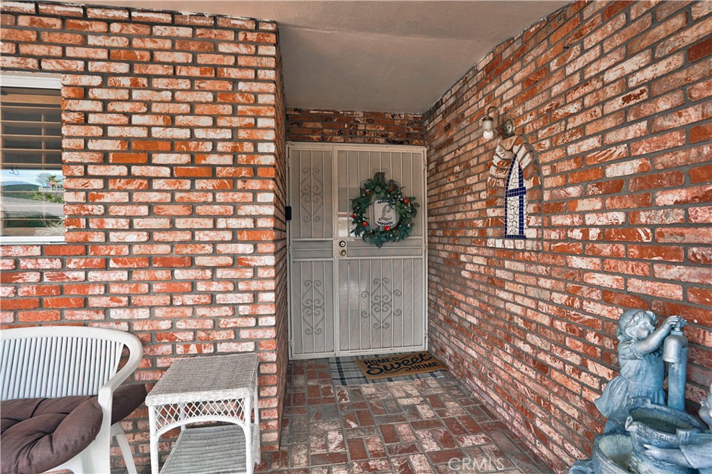 25990 Roanoke Road Menifee, CA 92586 - Photo 9 of 47 a view of a door and outdoor space