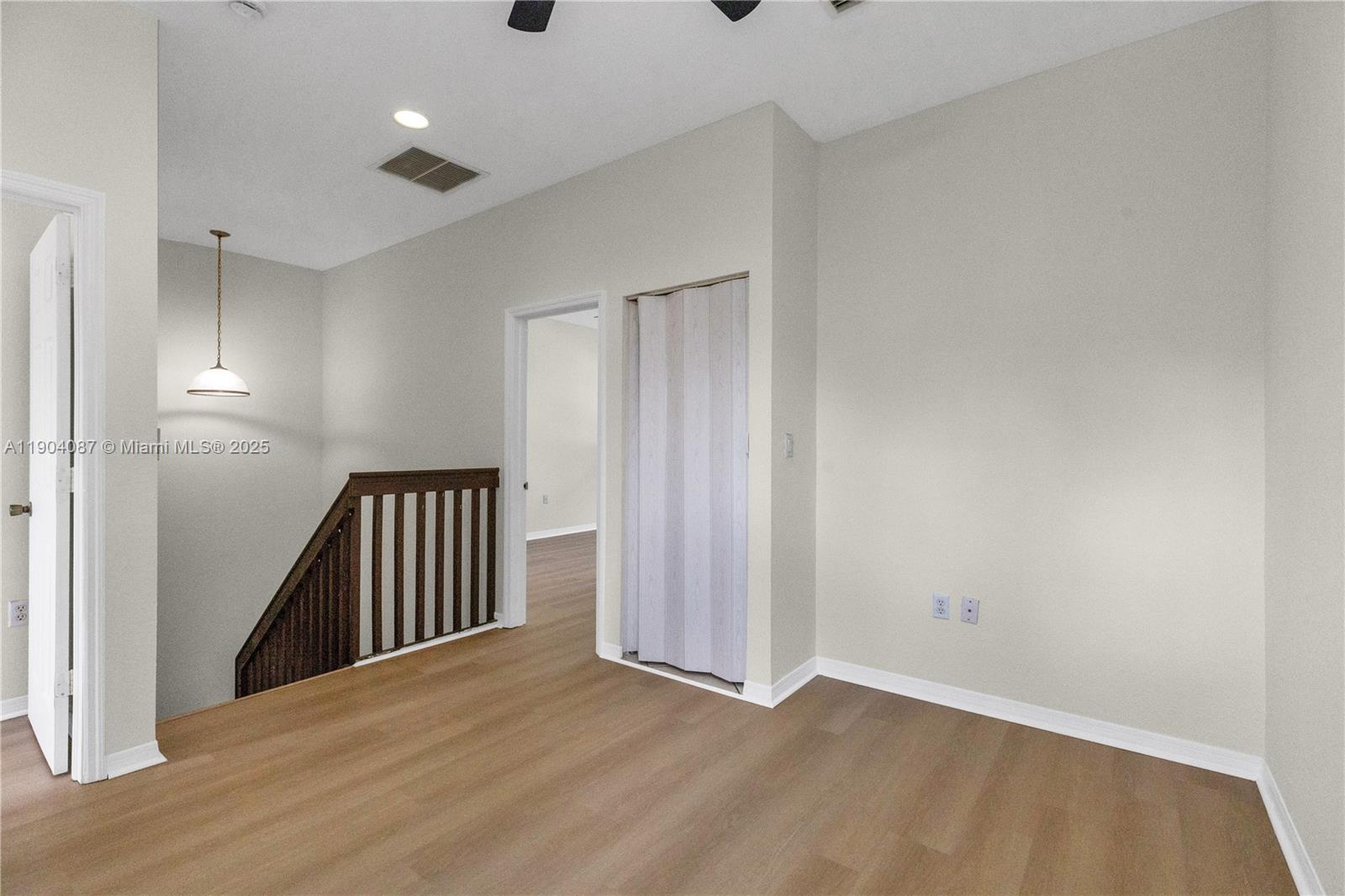 3459 Merrick Lane, Unit 501 Margate, FL 33063 - Photo 14 of 26 wooden floor in an empty room