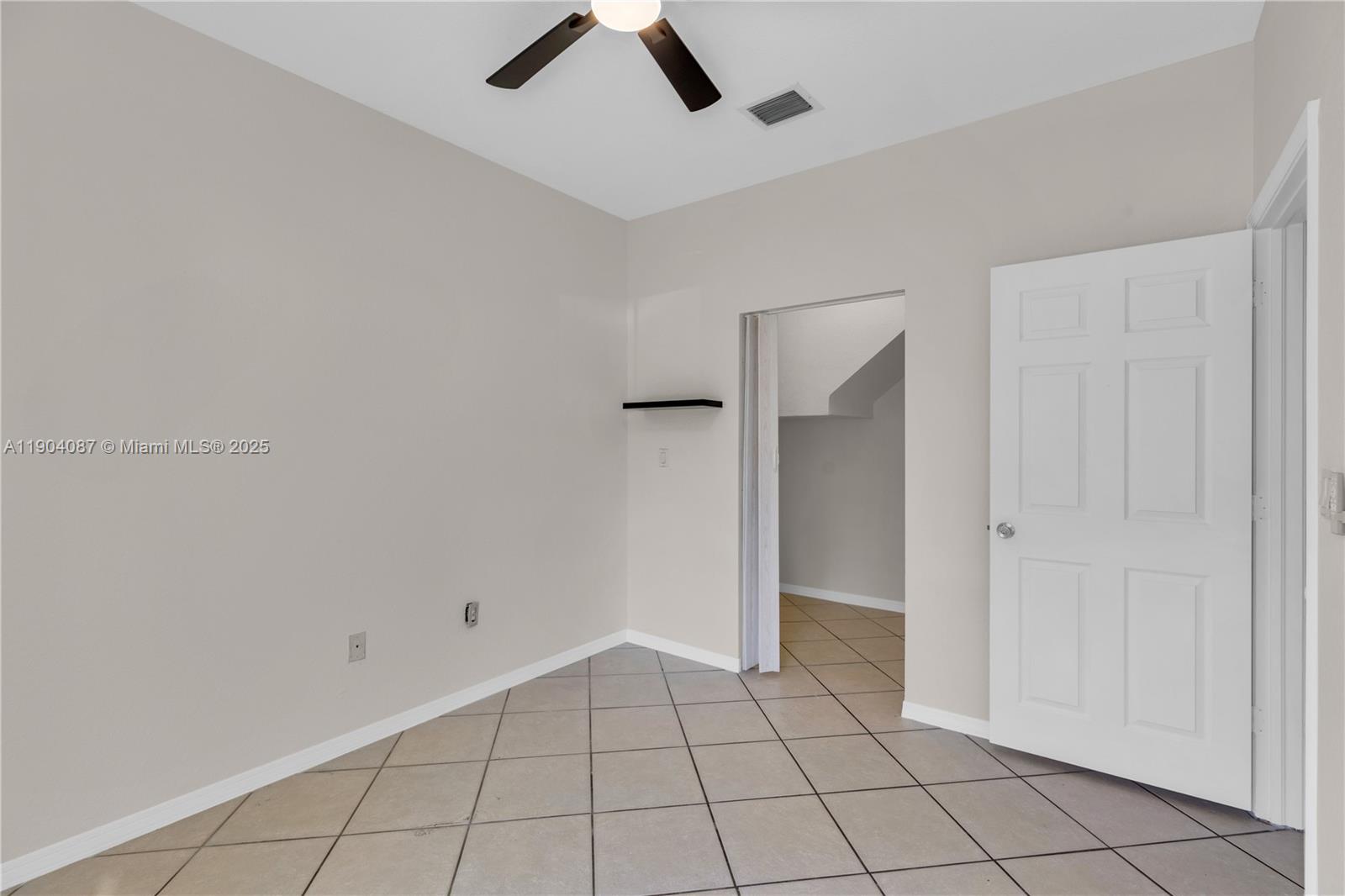 3459 Merrick Lane, Unit 501 Margate, FL 33063 - Photo 15 of 26 a view of an empty room and window