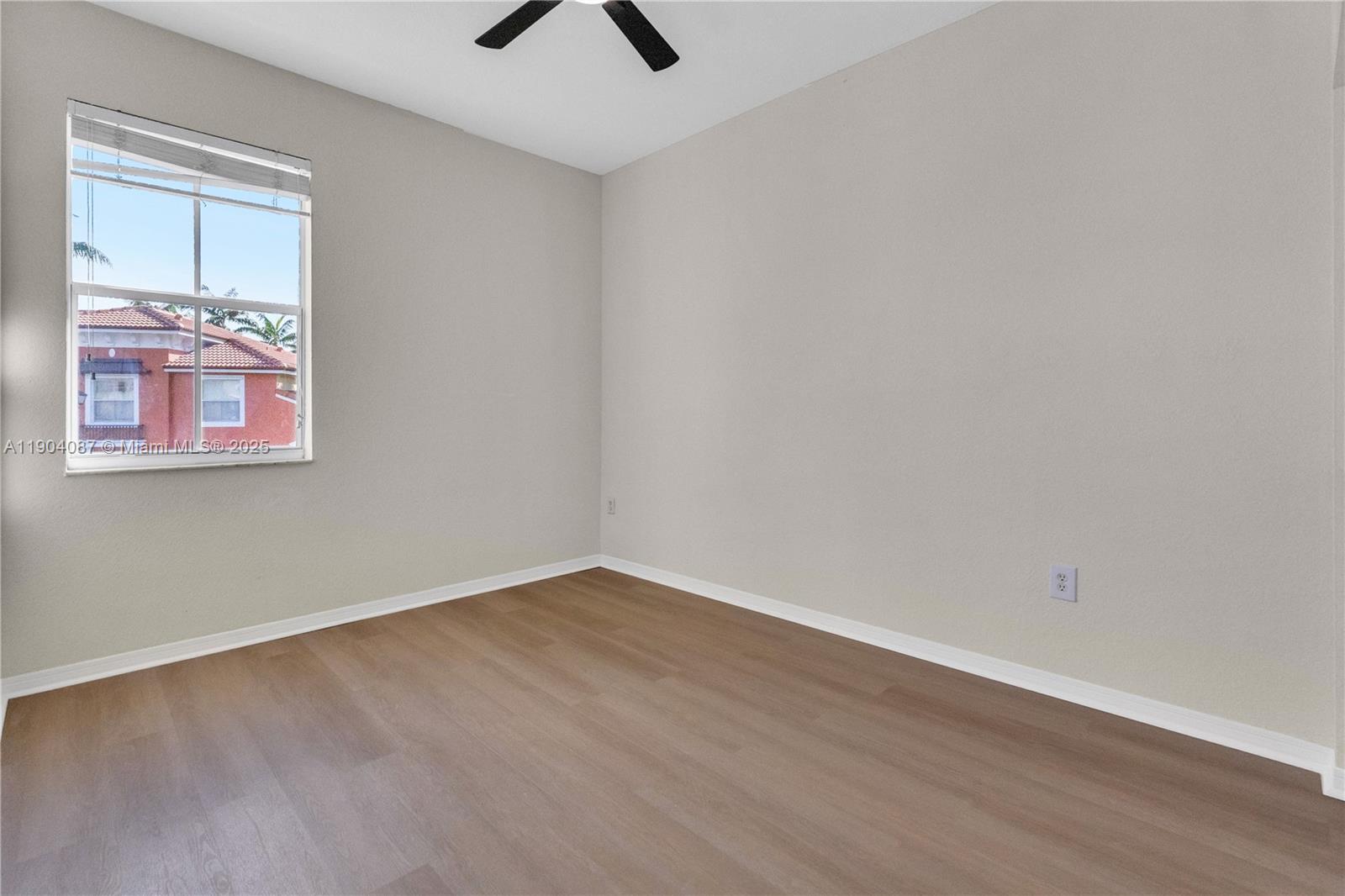 3459 Merrick Lane, Unit 501 Margate, FL 33063 - Photo 8 of 26 an empty room with a window