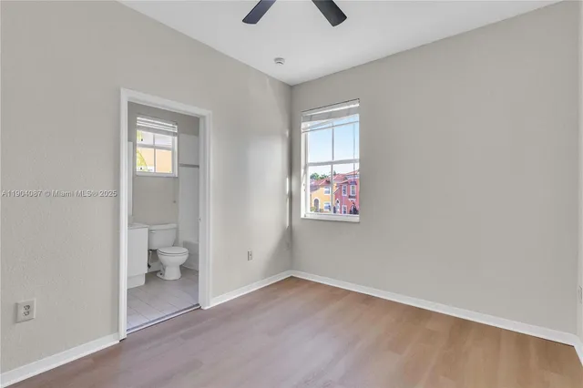 a view of an empty room with a bathroom