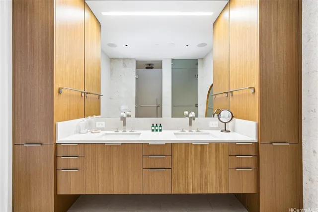 a bathroom with a double vanity sink and a mirror