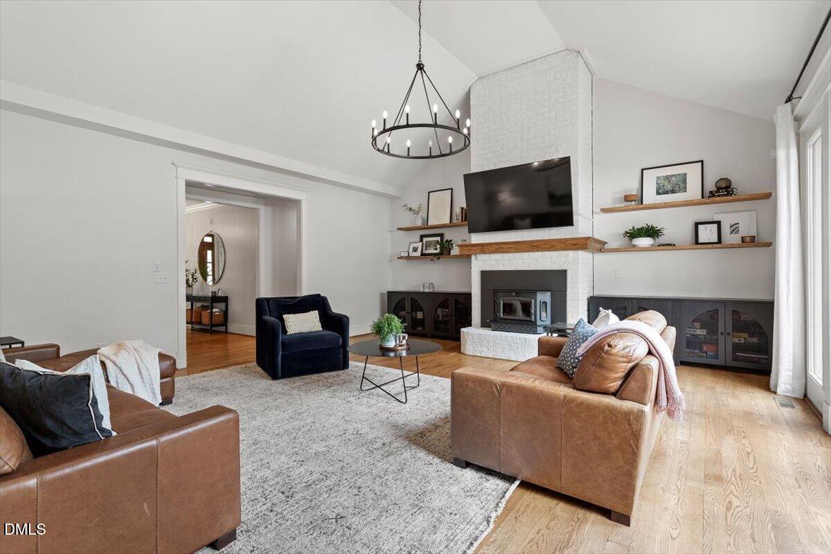 595 Billets Run Moncure, NC 27559 - Photo 18 of 54 a living room with furniture a flat screen tv and a fireplace