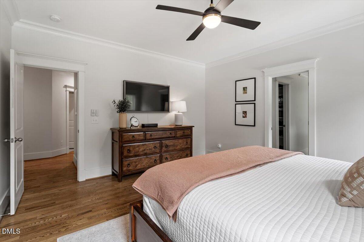 595 Billets Run Moncure, NC 27559 - Photo 29 of 54 a bedroom with a bed and a flat screen tv