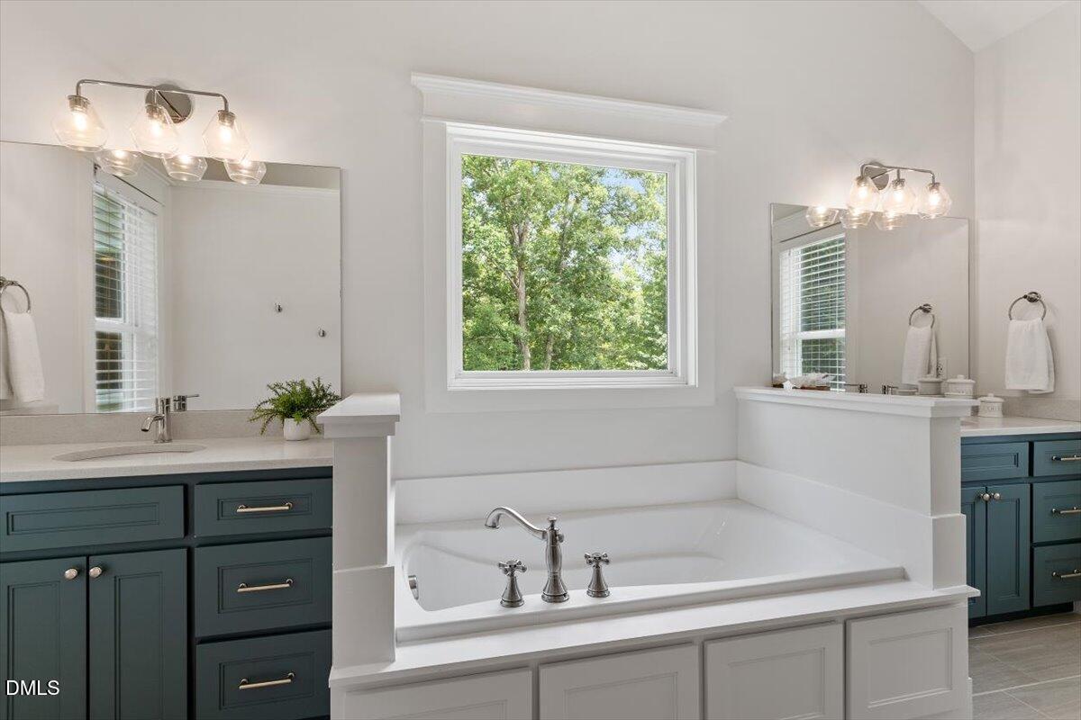 595 Billets Run Moncure, NC 27559 - Photo 34 of 54 a bathroom with a sink and a mirror