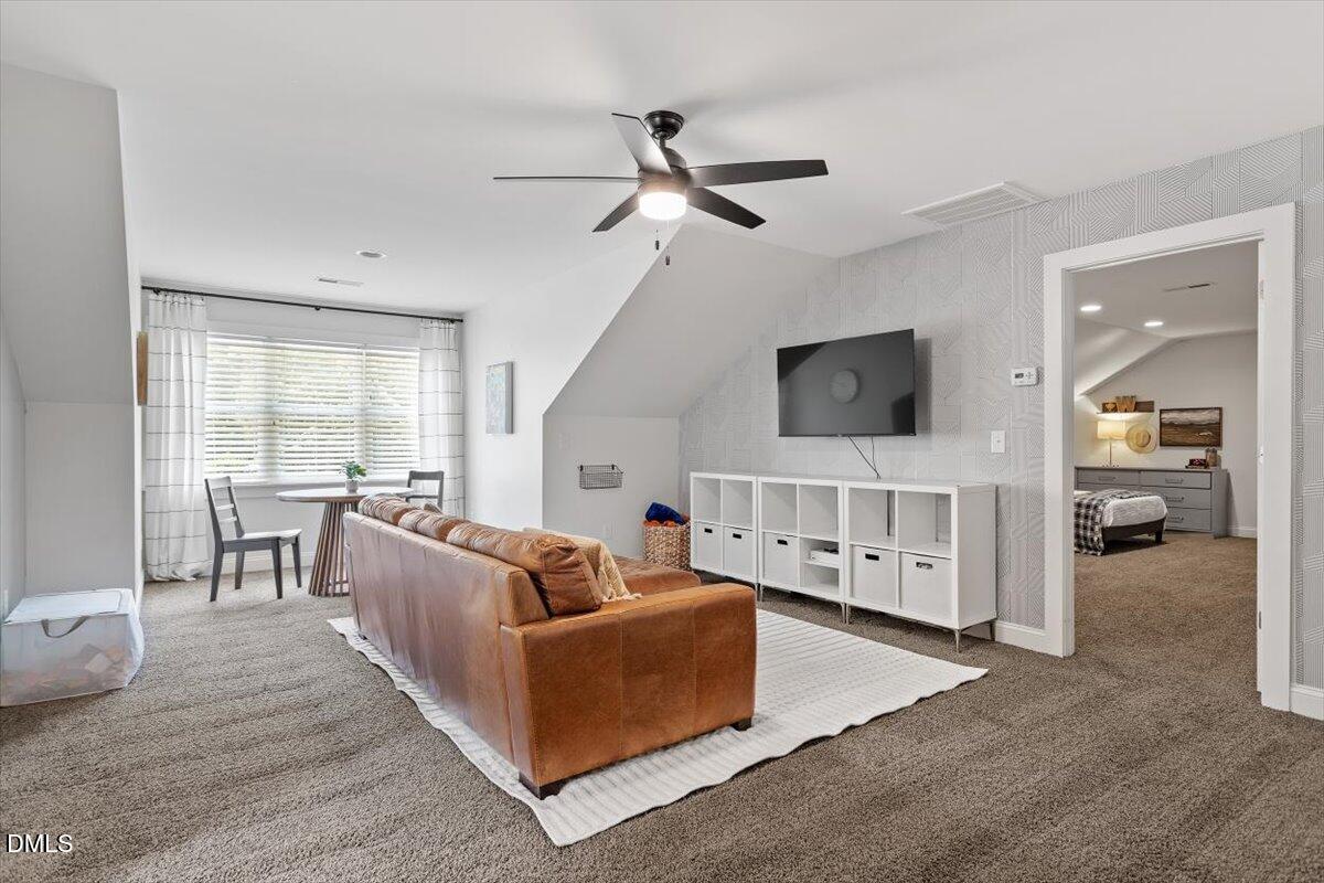 595 Billets Run Moncure, NC 27559 - Photo 41 of 54 a living room with furniture and a flat screen tv