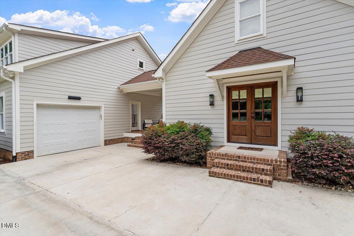 595 Billets Run Moncure, NC 27559 - Photo 51 of 54 a view of house with potted plants and a bench