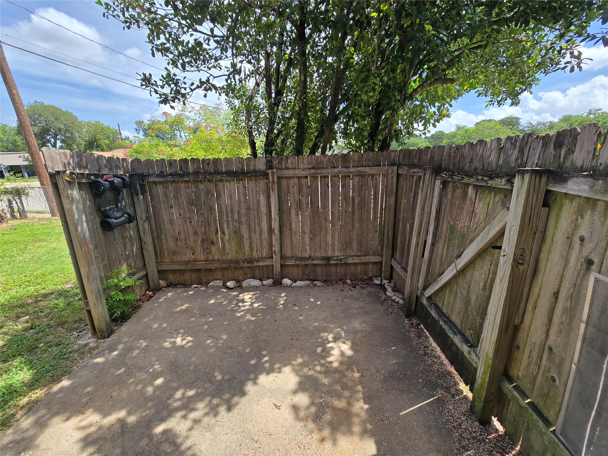 6206 Buffalo Pass, Unit A Austin, TX 78745 - Photo 20 of 24 Secure yard space with wooden fencing and a sturdy gate, offering a private outdoor area.