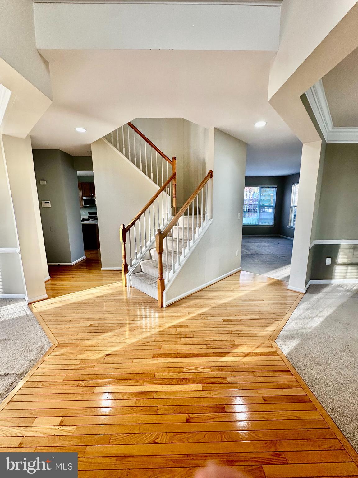 43438 Oxen Lane Chantilly, VA 20152 - Photo 19 of 49 a view of a hall with wooden floor and staircase