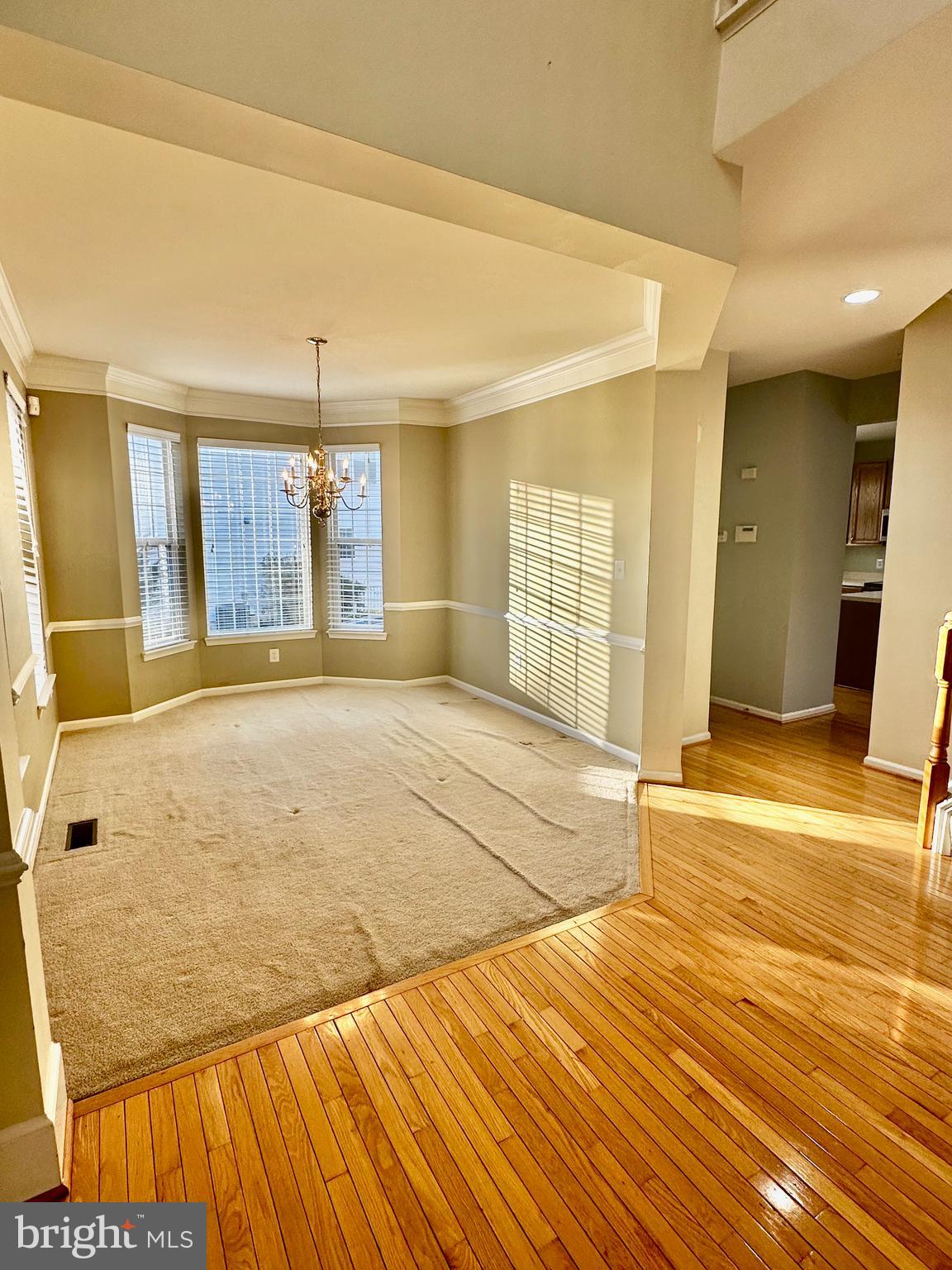 43438 Oxen Lane Chantilly, VA 20152 - Photo 20 of 49 a view of a livingroom with wooden floor and kitchen space