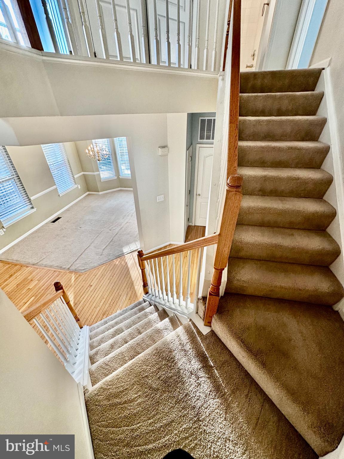43438 Oxen Lane Chantilly, VA 20152 - Photo 22 of 49 a view of staircase with white walls and a wooden floor