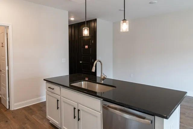 a kitchen with a sink and a window