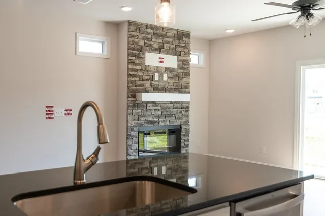 a bathroom with a fireplace and a shower