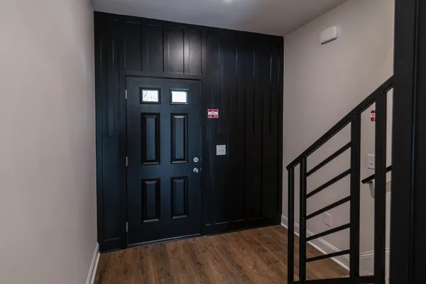 a bathroom with double vanity sinks and a mirror