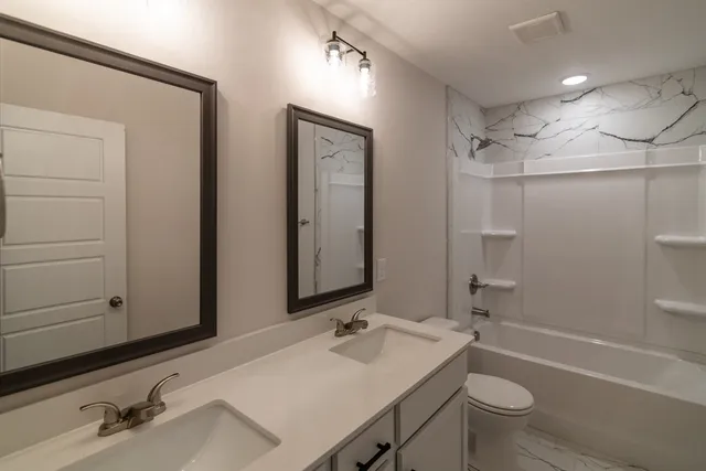 a view of a house with a yard and plants