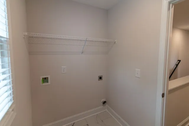 a front view of a house with a yard table and chairs