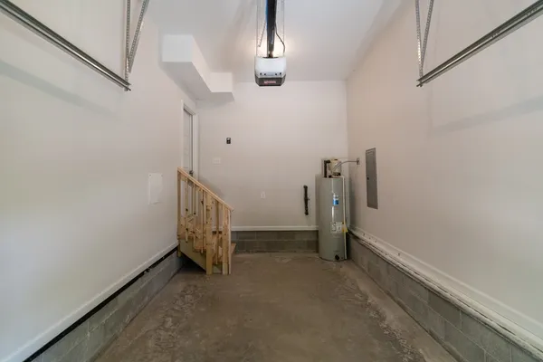 a view of a patio with table and chairs under an umbrella