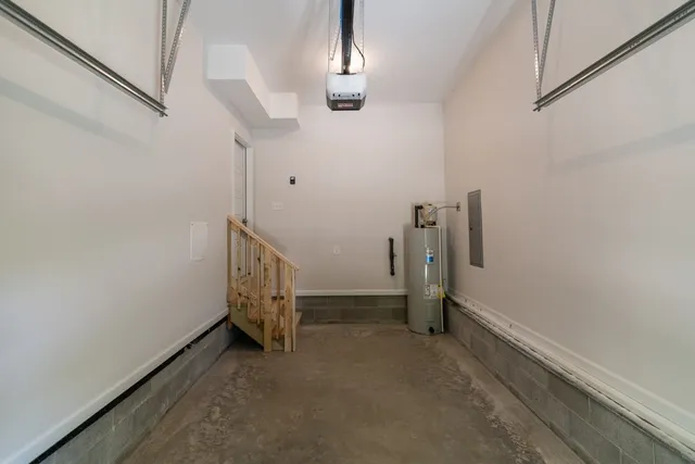 a view of a patio with table and chairs under an umbrella