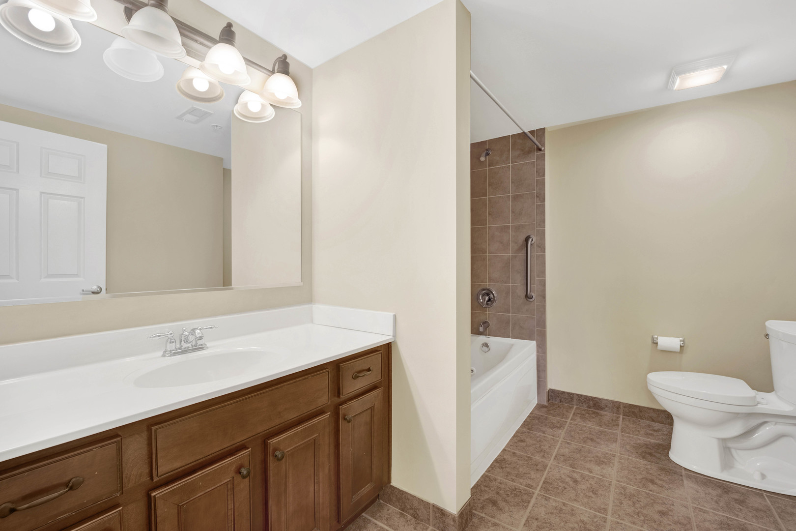 201 West Brush Hill Road, Unit 203 Elmhurst, IL 60126 - Photo 11 of 24 a bathroom with a sink a toilet and a bathtub