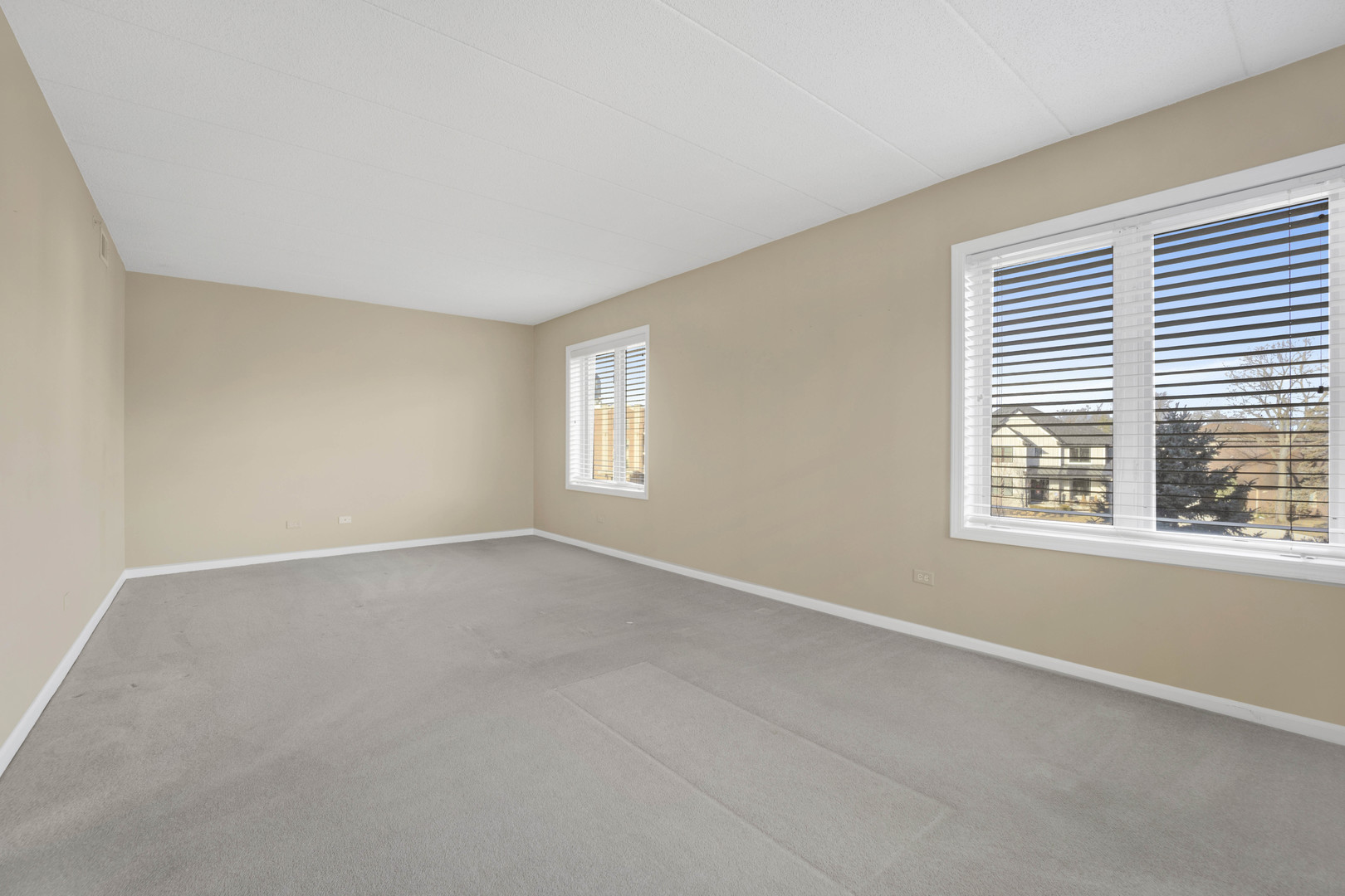 201 West Brush Hill Road, Unit 203 Elmhurst, IL 60126 - Photo 13 of 24 an empty room with a window