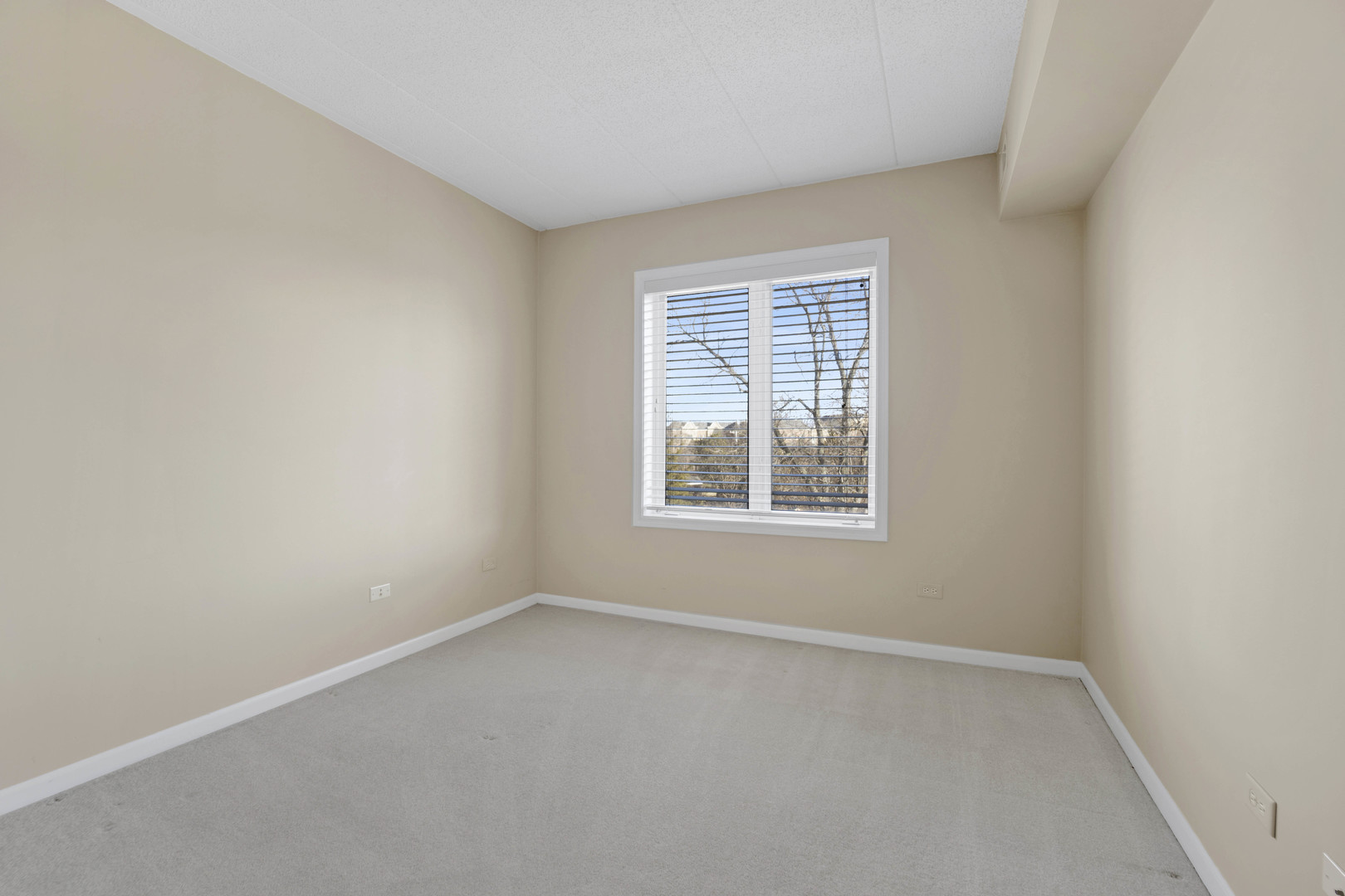 201 West Brush Hill Road, Unit 203 Elmhurst, IL 60126 - Photo 17 of 24 an empty room with a window