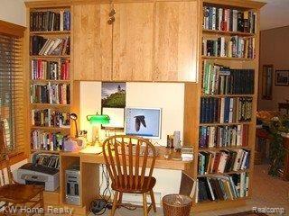 6768 Lakeshore Road Palms, MI 48465 - Photo 13 of 19 LIBRARY WITH BUILT INS