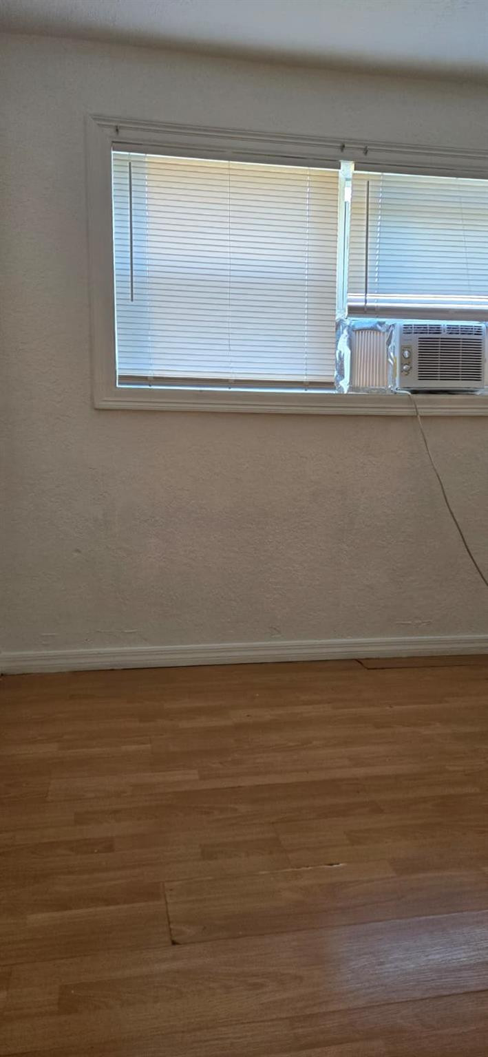112 Newton Road West Park, FL 33023 - Photo 11 of 31 a view of a room with wooden floor and window