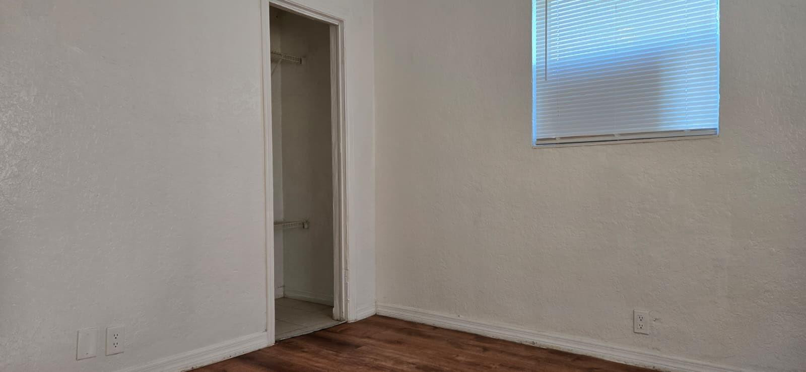 112 Newton Road West Park, FL 33023 - Photo 12 of 31 a view of a small space with wooden floor and a window