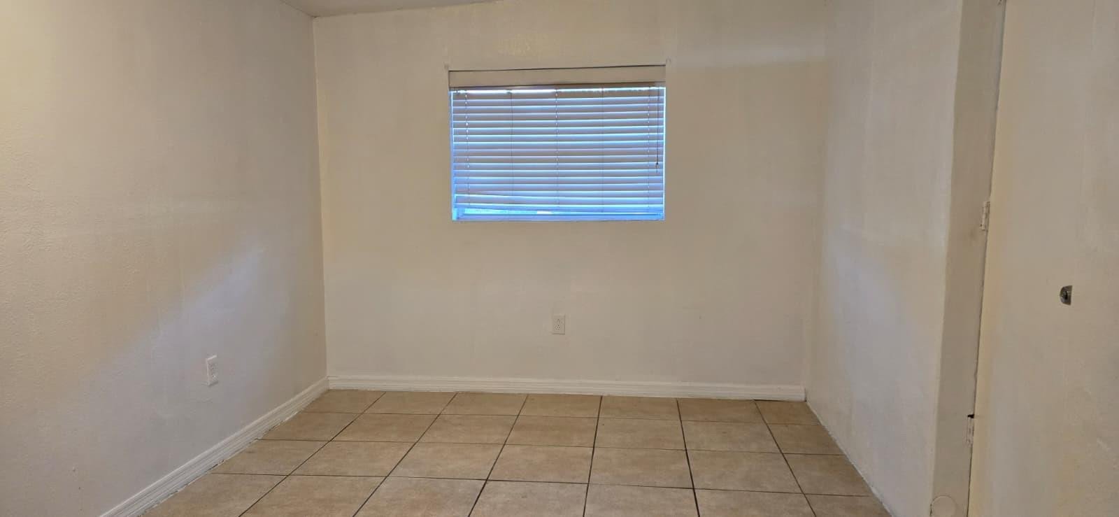 112 Newton Road West Park, FL 33023 - Photo 16 of 31 a view of an empty room with a window