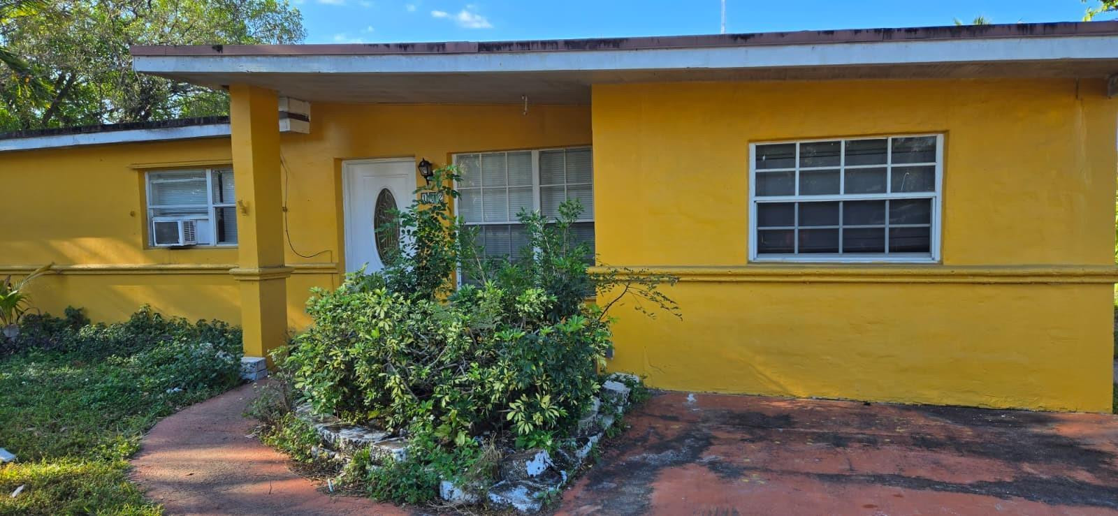 112 Newton Road West Park, FL 33023 - Photo 2 of 31 a front view of a house with a yard