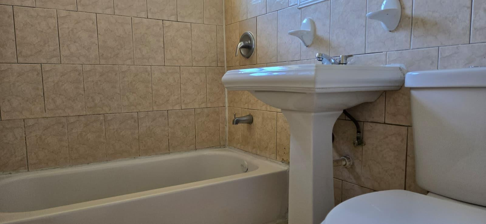 112 Newton Road West Park, FL 33023 - Photo 8 of 31 a bathroom with a sink and toilet