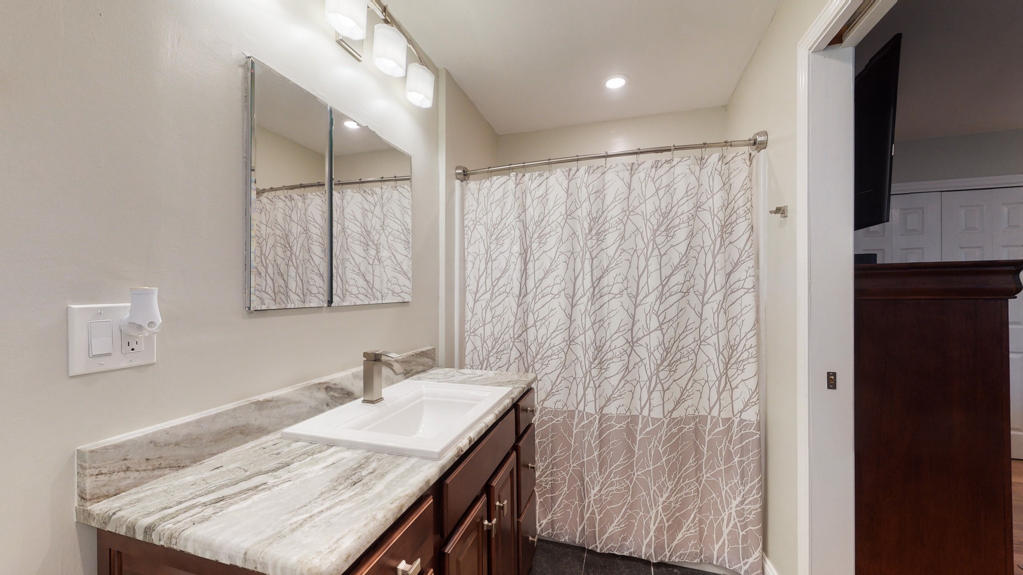 712 Spring Creek Road Lebanon, TN 37087 - Photo 13 of 33 a bathroom with a granite countertop sink a mirror and shower