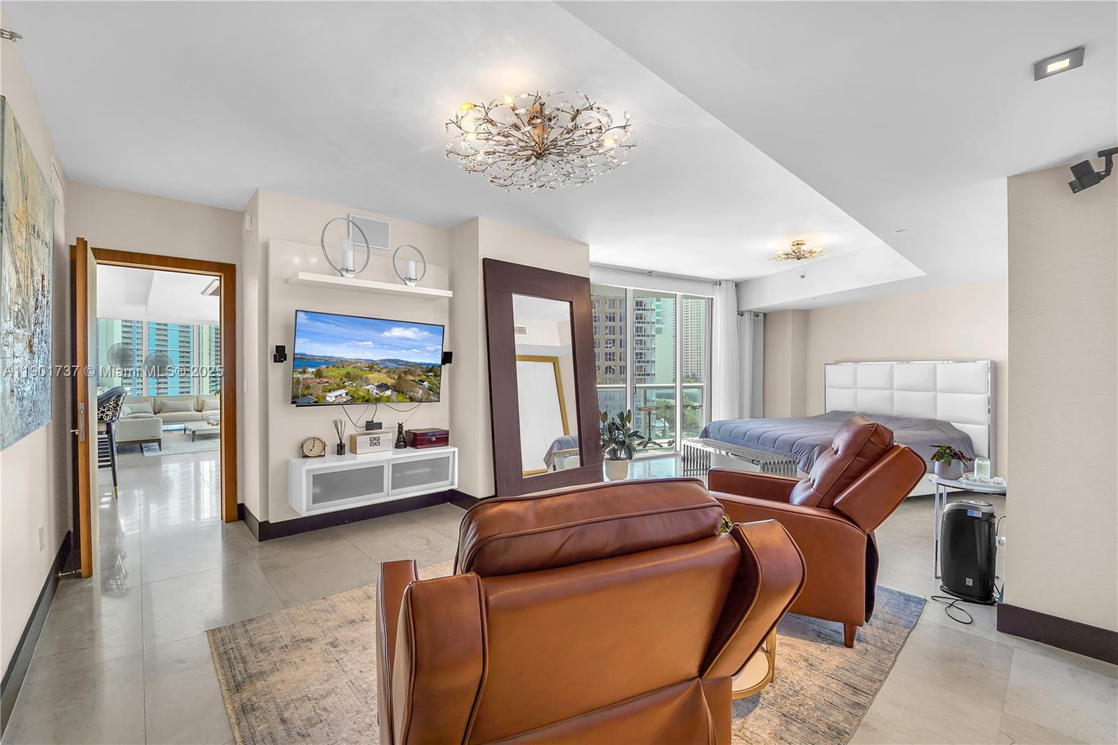 465 Brickell Avenue, Unit 1001 Miami, FL 33131 - Photo 20 of 42 a living room with furniture and a large window