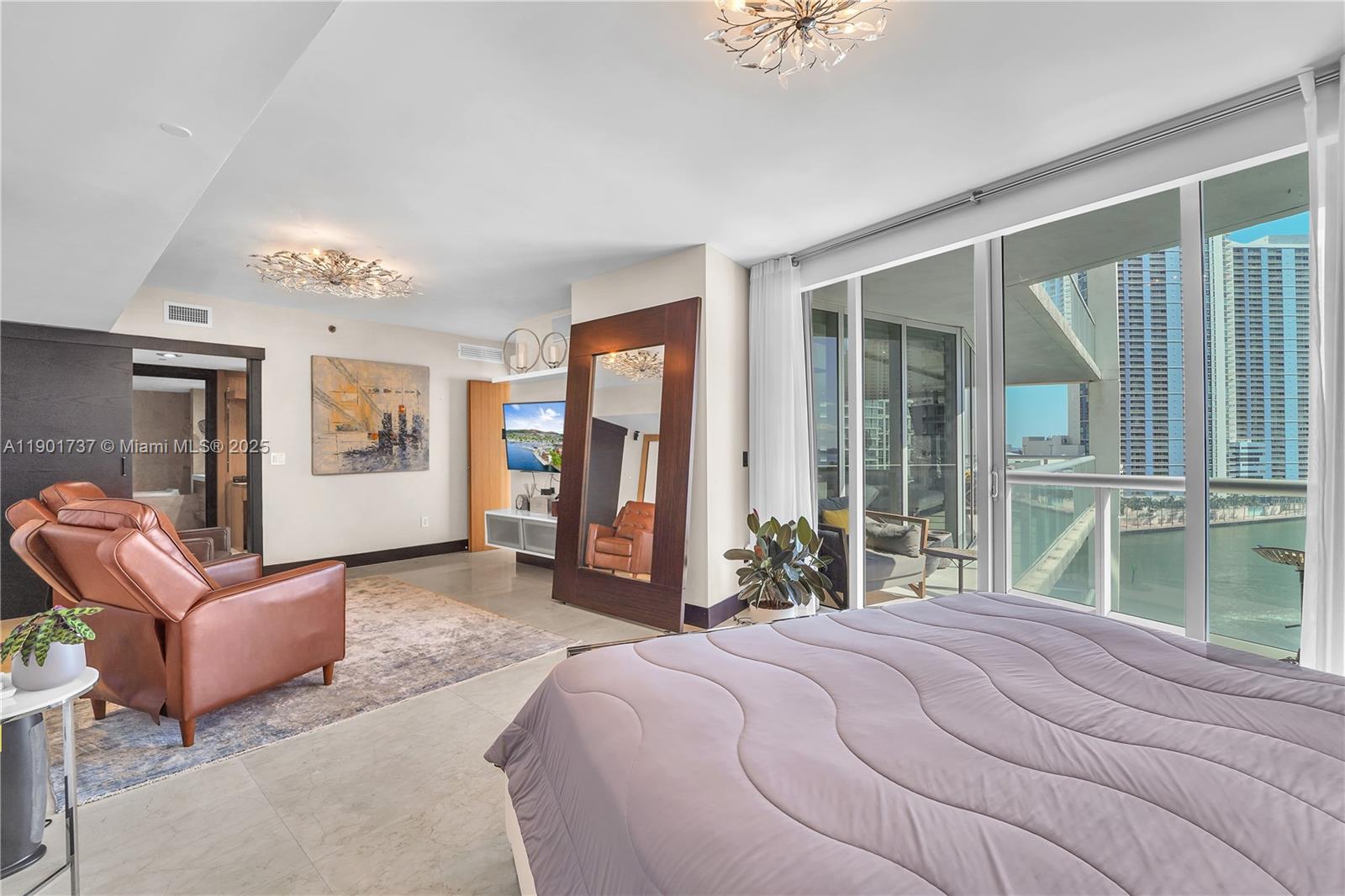 465 Brickell Avenue, Unit 1001 Miami, FL 33131 - Photo 23 of 42 a bedroom with a large bed and a large window