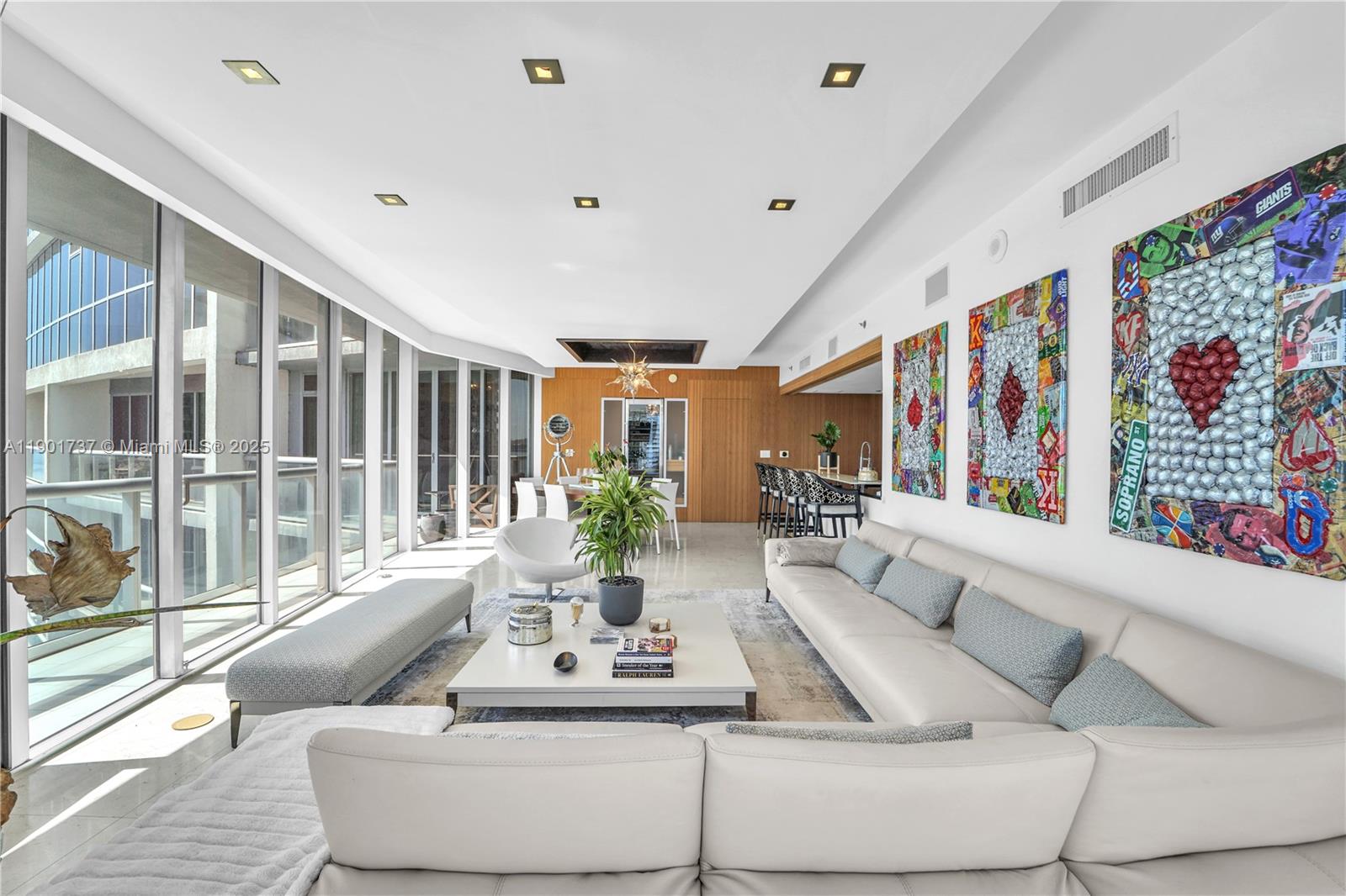 465 Brickell Avenue, Unit 1001 Miami, FL 33131 - Photo 3 of 42 a living room with furniture and large windows