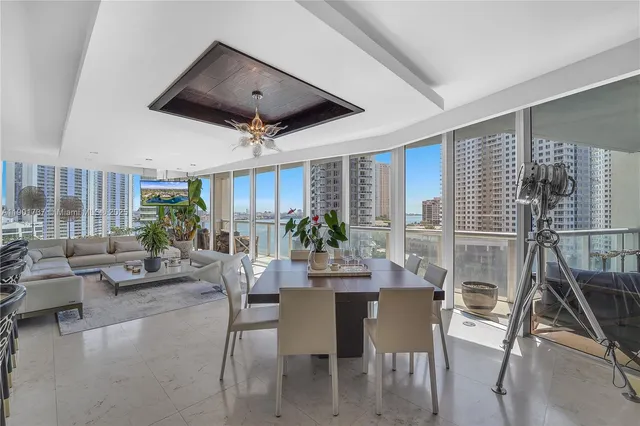 a view of a livingroom with furniture and a potted plant