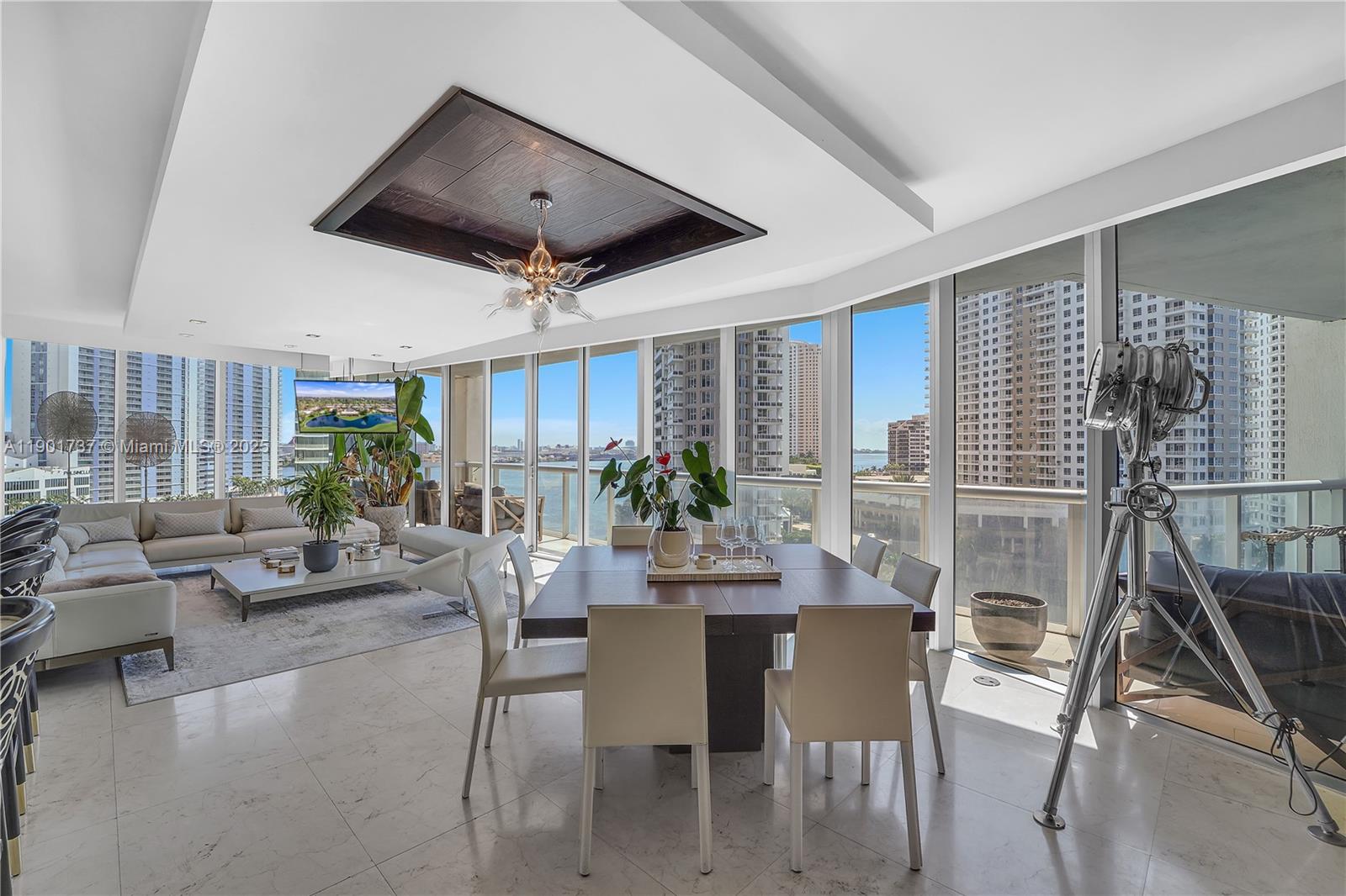 465 Brickell Avenue, Unit 1001 Miami, FL 33131 - Photo 5 of 42 a view of a livingroom with furniture and a potted plant