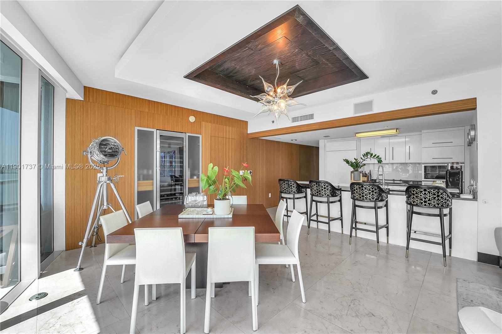 465 Brickell Avenue, Unit 1001 Miami, FL 33131 - Photo 9 of 42 a dining room with furniture garden view and a large window