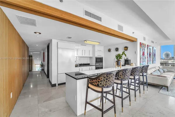 a view of a kitchen and dining room