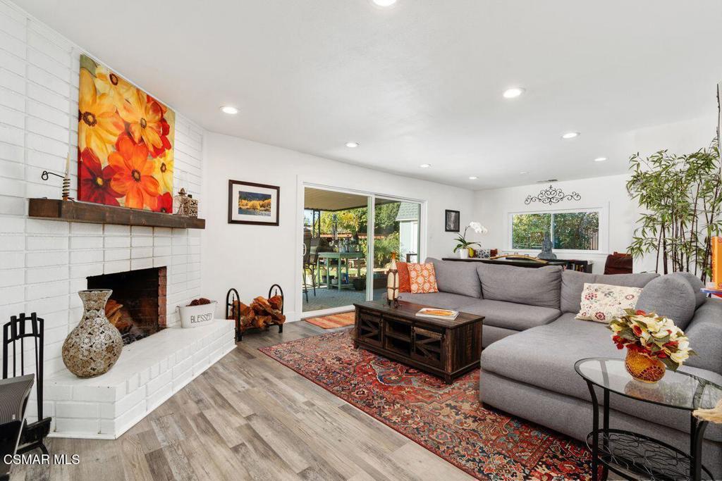1135 Donner Avenue Simi Valley, CA 93065 - Photo 14 of 48 a living room with furniture a fireplace and a flat screen tv