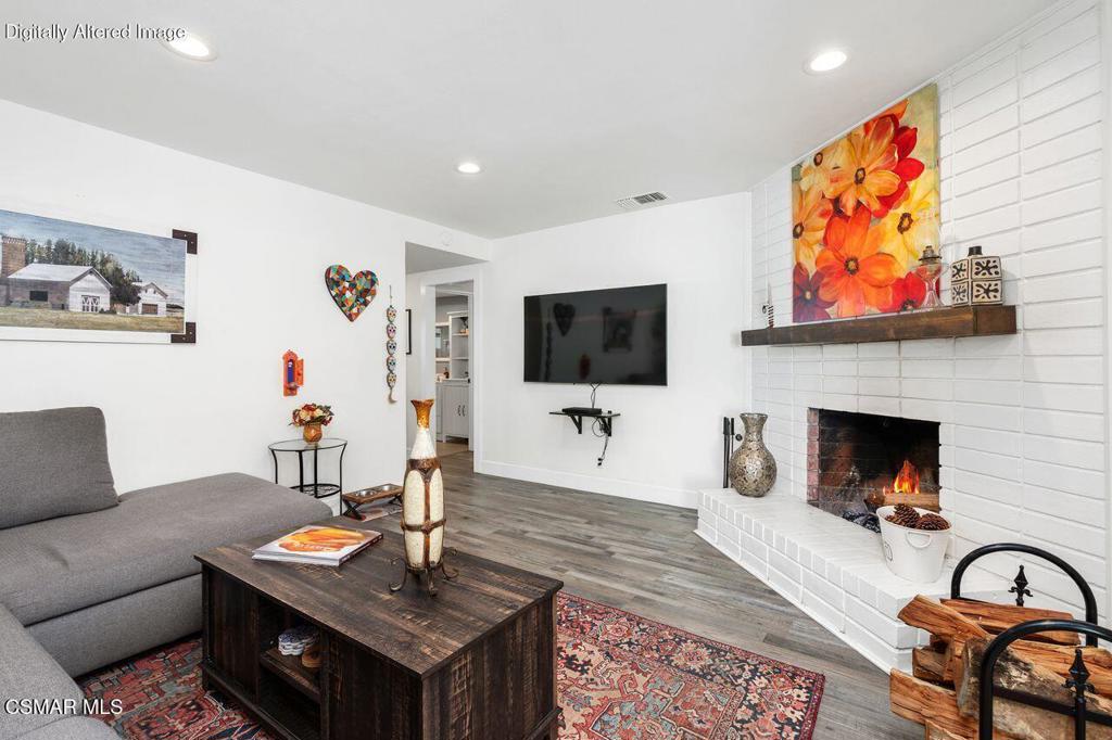 1135 Donner Avenue Simi Valley, CA 93065 - Photo 18 of 48 a living room with furniture and a flat screen tv