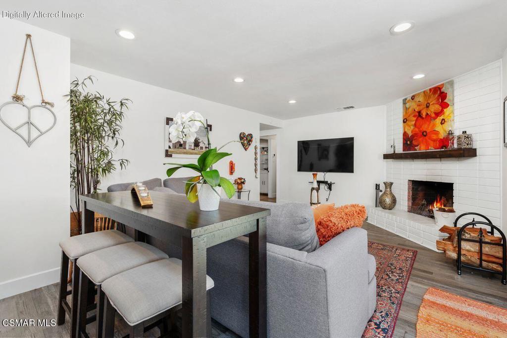 1135 Donner Avenue Simi Valley, CA 93065 - Photo 21 of 48 a living room with furniture flat screen tv and a fireplace