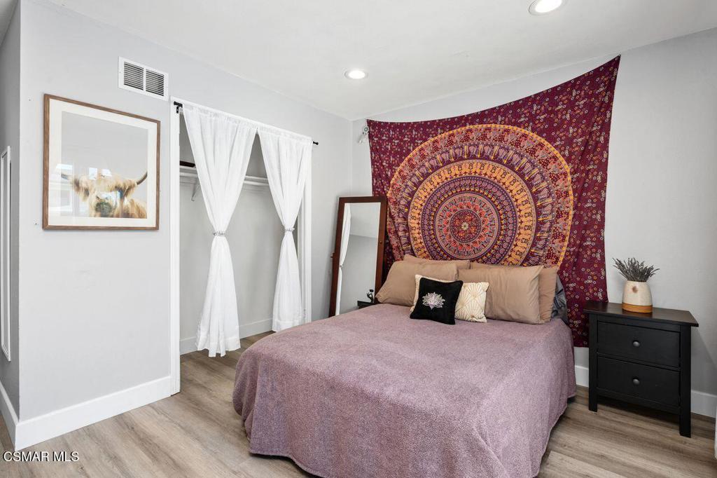 1135 Donner Avenue Simi Valley, CA 93065 - Photo 25 of 48 a bedroom with a bed and a painting on the wall