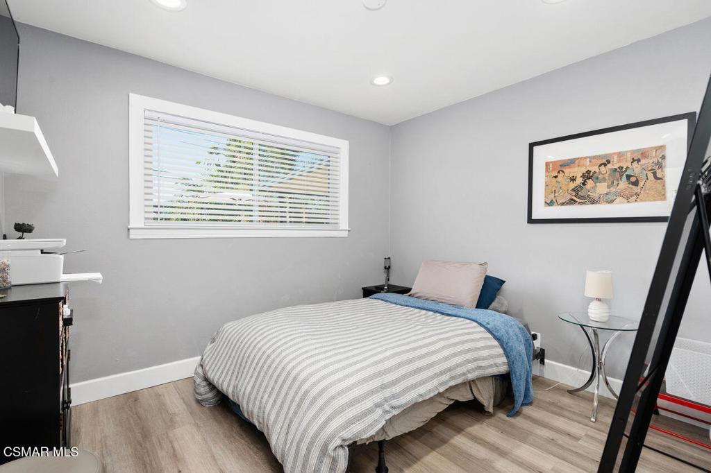 1135 Donner Avenue Simi Valley, CA 93065 - Photo 26 of 48 a bedroom with a bed and a painting on the wall