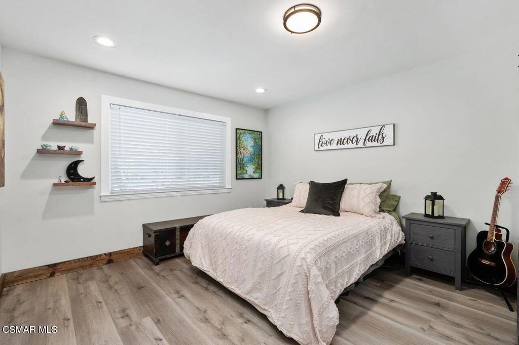 1135 Donner Avenue Simi Valley, CA 93065 - Photo 27 of 48 a bedroom with a bed and a large window