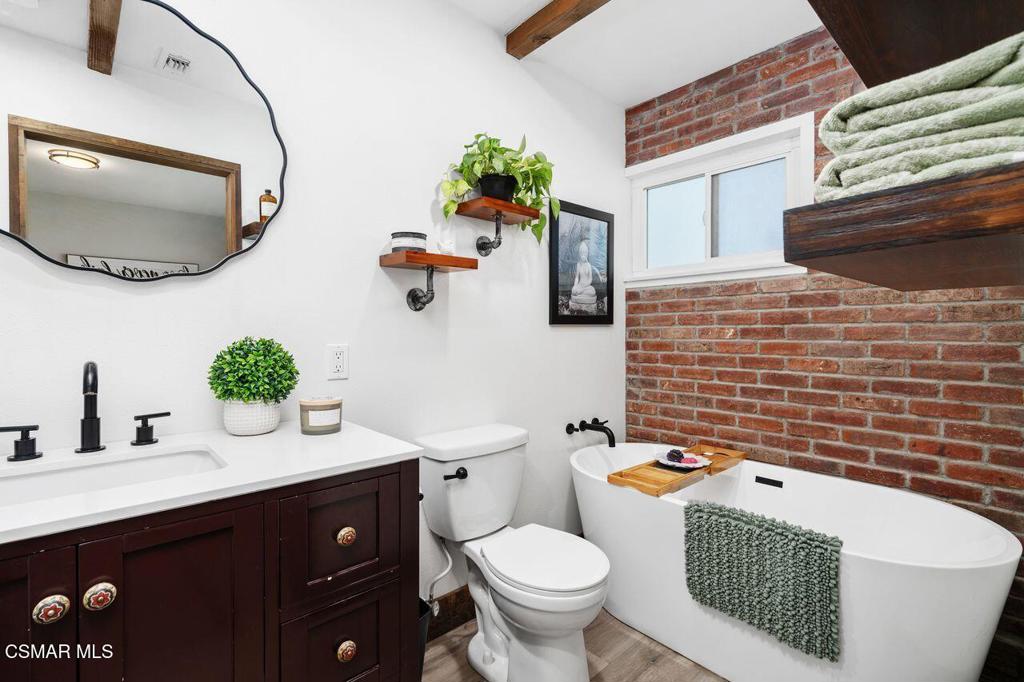 1135 Donner Avenue Simi Valley, CA 93065 - Photo 30 of 48 a bathroom with a sink a toilet and mirror