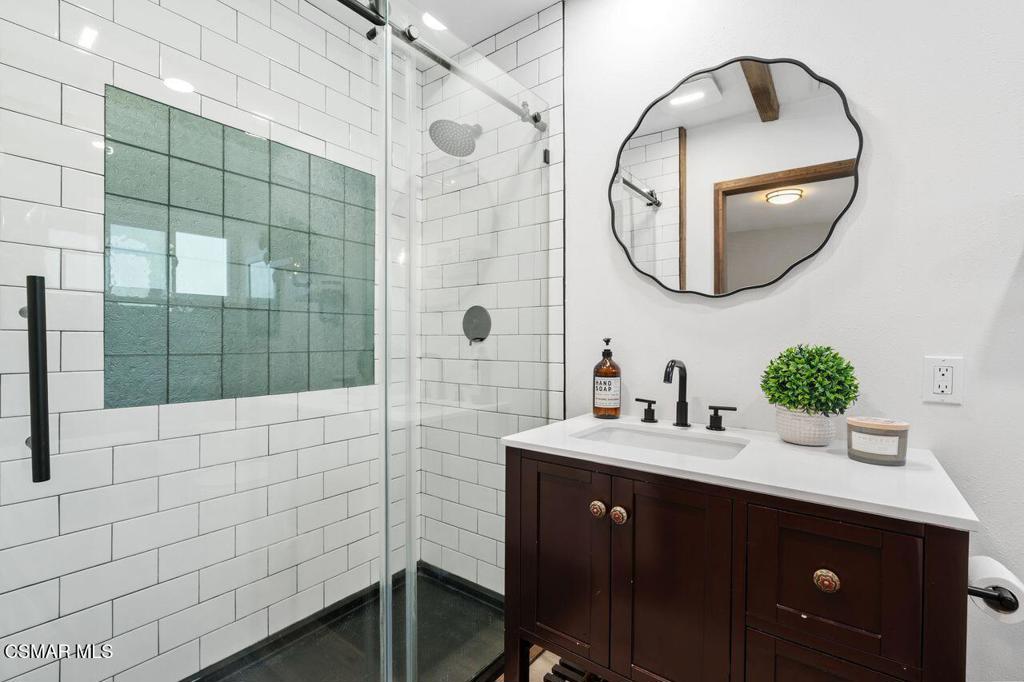 1135 Donner Avenue Simi Valley, CA 93065 - Photo 31 of 48 a bathroom with a sink vanity and a mirror