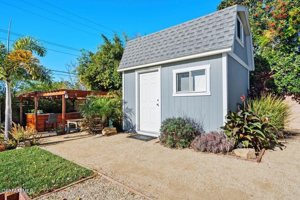 1135 Donner Avenue Simi Valley, CA 93065 - Photo 32 of 48 a view of a house with a yard and potted plants