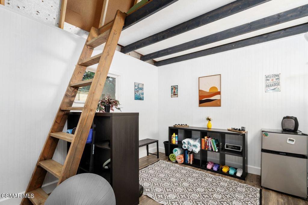 1135 Donner Avenue Simi Valley, CA 93065 - Photo 33 of 48 a living room with furniture and a baby crib